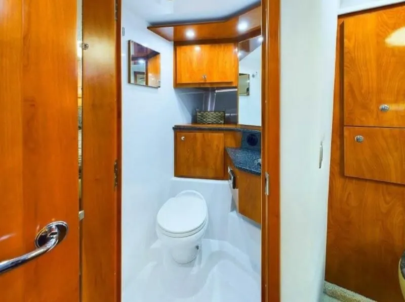 Slide: The Image of 2008 Four Winns V458 yacht bathroom with wooden cabinetry and modern fixtures. - 17