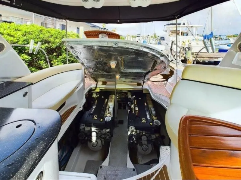 Slide: The Image of 2008 Four Winns V458 yacht engine compartment with open hatch, docked at marina. - 19