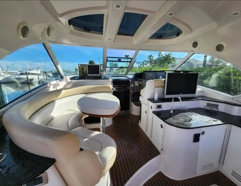 Slide: The Image of Luxurious interior of 2008 Four Winns V458 yacht with modern amenities and panoramic windows. - 9