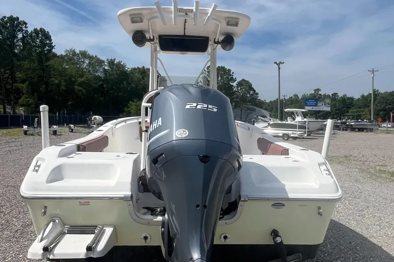 Slide: The Image of 2010 Tidewater 216 CC Adventure boat with Yamaha 225 engine, parked outdoors. - 9
