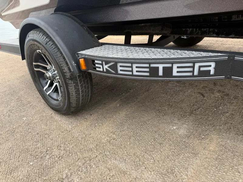 Slide: The Image of 2022 Skeeter ZX 150 trailer with Goodyear tire on concrete surface. - 20