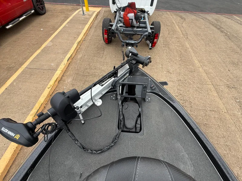 Slide: The Image of 2022 Skeeter ZX 150 boat with Minn Kota trolling motor and fish finder, parked on trailer. - 31