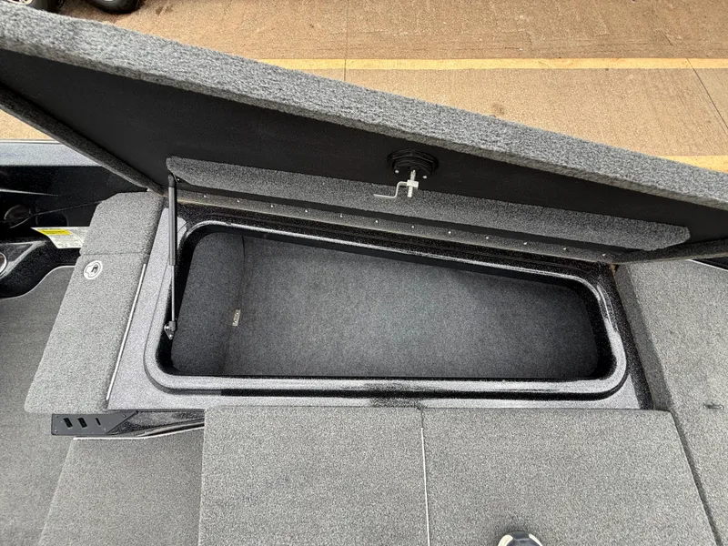 Slide: The Image of Open storage compartment in 2022 Skeeter ZX 150 boat, showcasing spacious interior. - 32