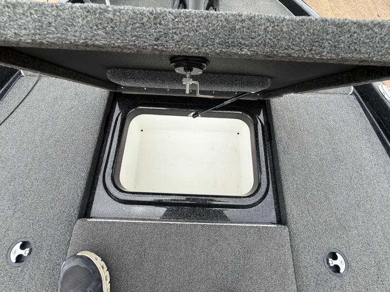 Slide: The Image of Open storage compartment on 2022 Skeeter ZX 150 boat deck. - 33