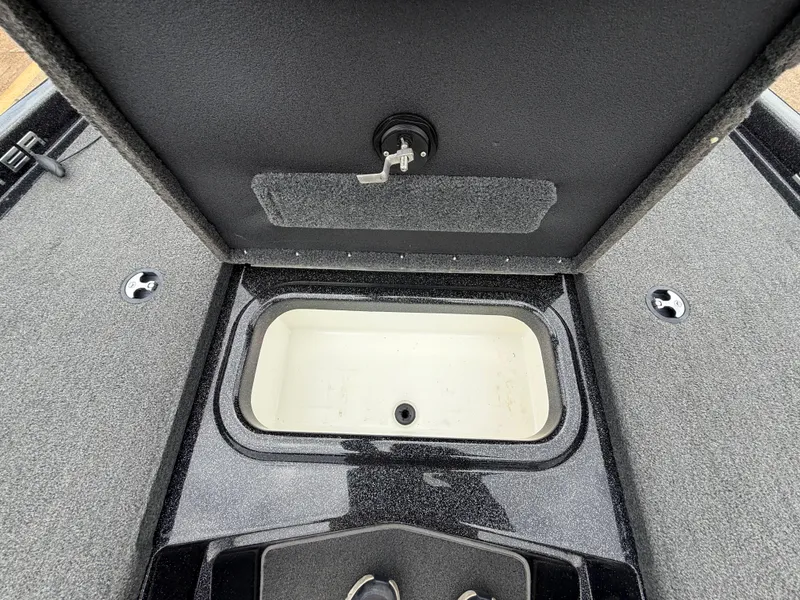 Slide: The Image of 2022 Skeeter ZX 150 boat storage compartment with open lid, showcasing interior space. - 34