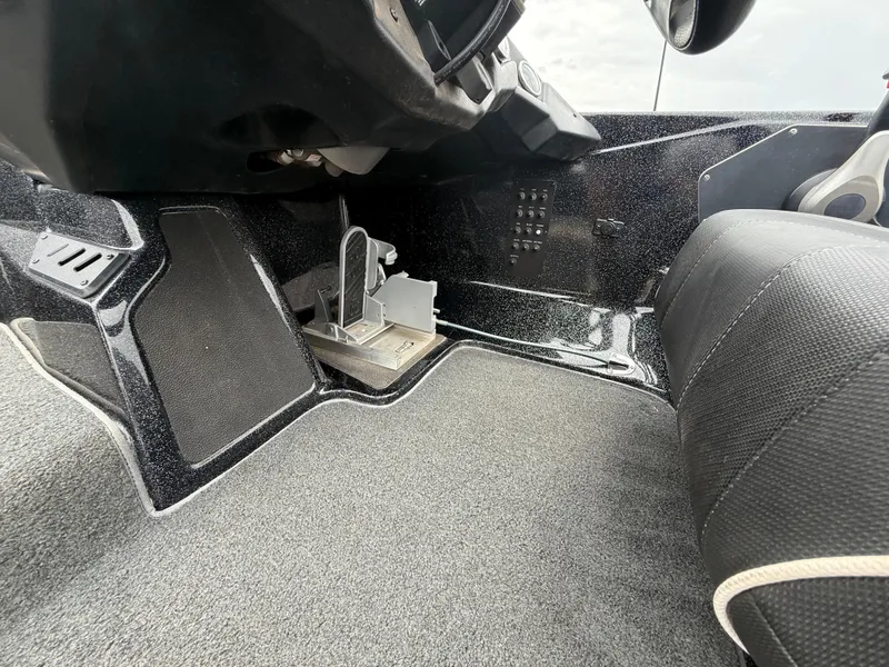 Slide: The Image of 2022 Skeeter ZX 150 boat interior showing foot pedal and control panel. - 41