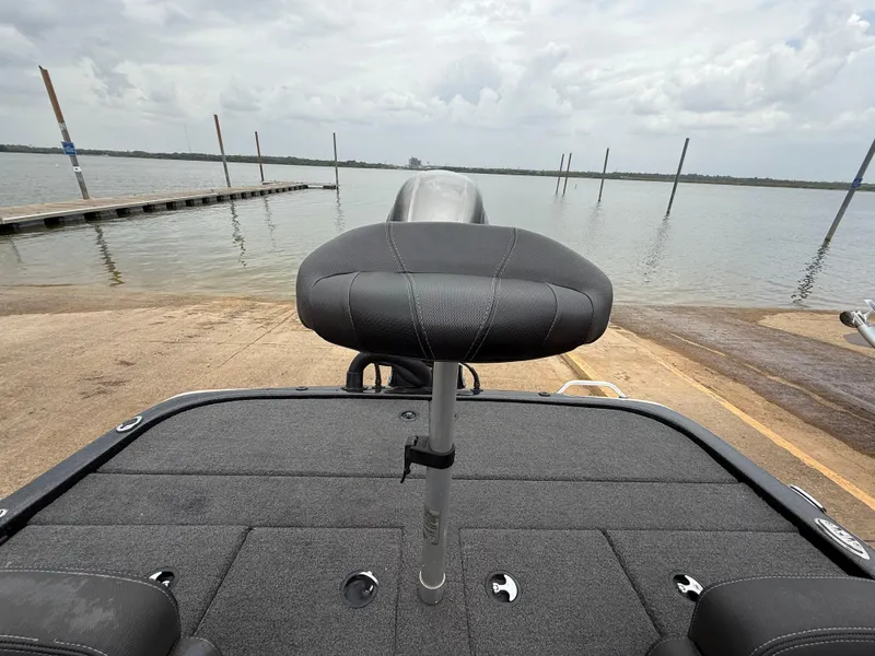 Slide: The Image of 2022 Skeeter ZX 150 boat seat at a lakeside dock. - 43