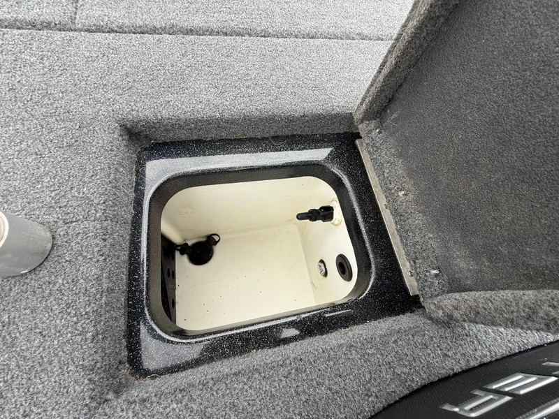Slide: The Image of Open storage compartment in 2022 Skeeter ZX 150 boat, featuring a clean interior. - 45