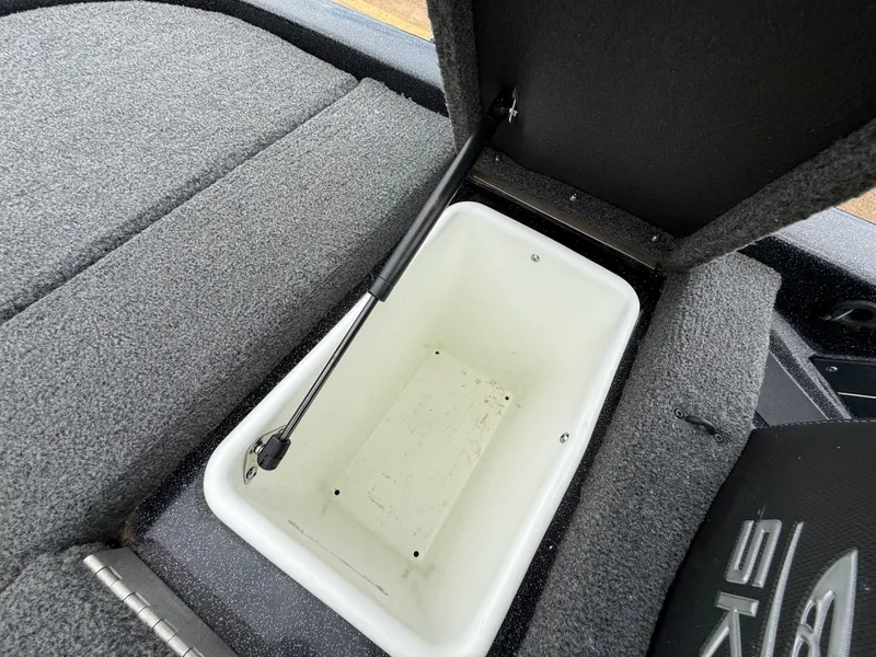Slide: The Image of 2022 Skeeter ZX 150 boat storage compartment with open lid and hydraulic support. - 46