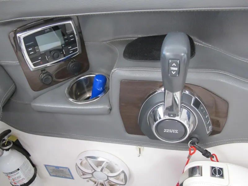 Slide: The Image of 2018 Chaparral 287 SSX boat control panel with Volvo Penta throttle and audio system. - 12