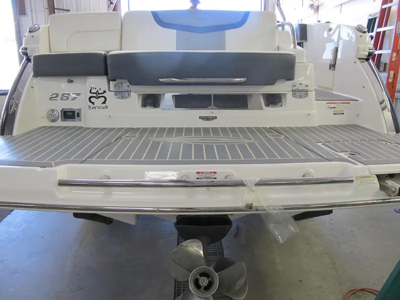 Slide: The Image of 2018 Chaparral 287 SSX boat stern with swim platform and seating. - 2