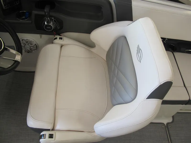 Slide: The Image of 2018 Chaparral 287 SSX boat interior with luxurious white and gray seating. - 5