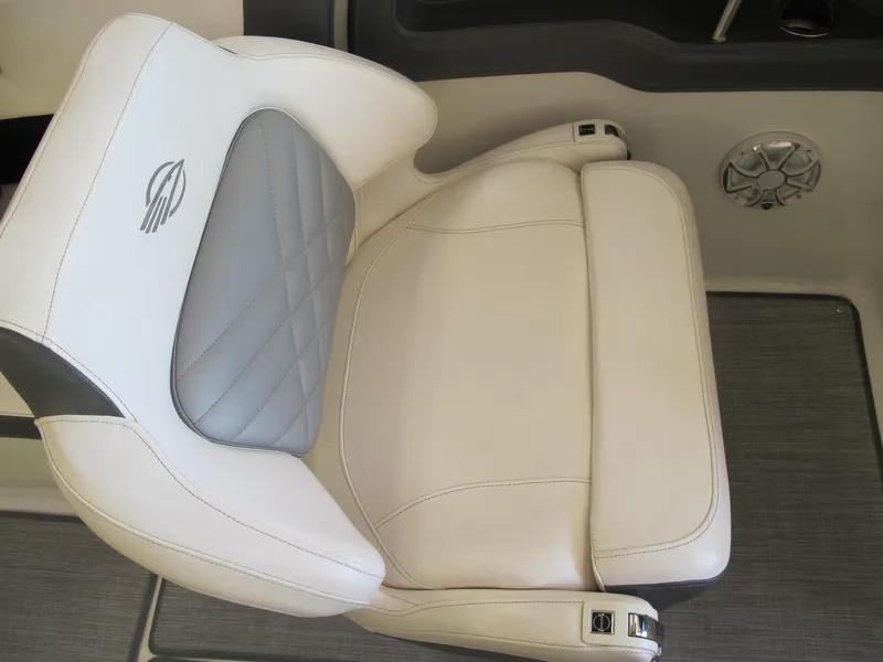 Slide: The Image of 2018 Chaparral 287 SSX boat seat with white and gray upholstery. - 6