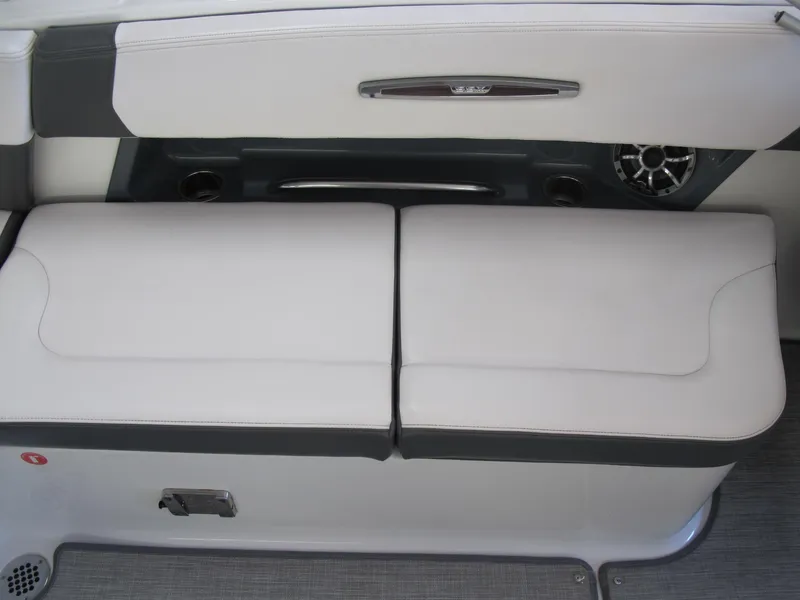 Slide: The Image of 2018 Chaparral 287 SSX boat interior seating with white and gray upholstery. - 7