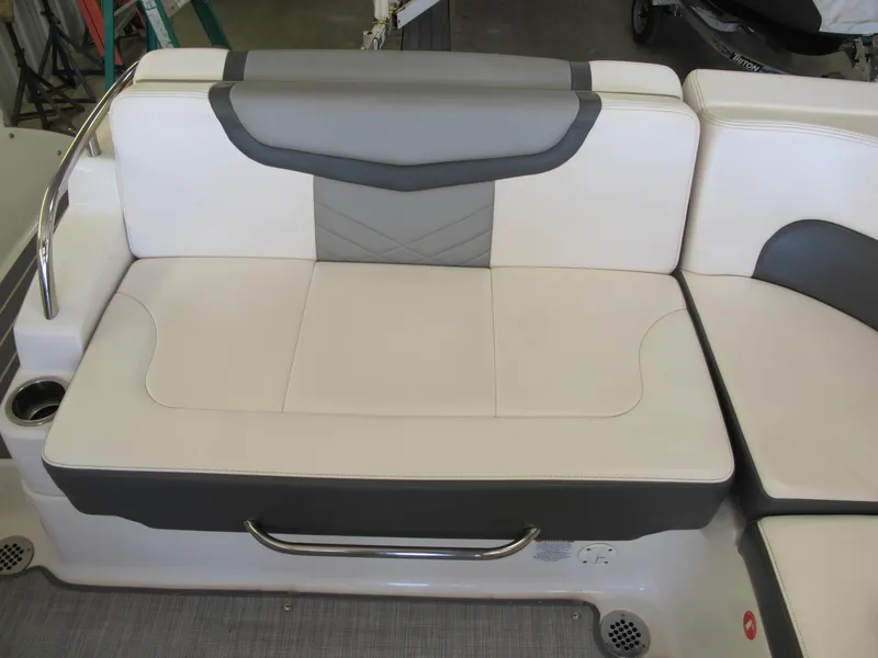 Slide: The Image of 2018 Chaparral 287 SSX boat seating with white and gray upholstery. - 9