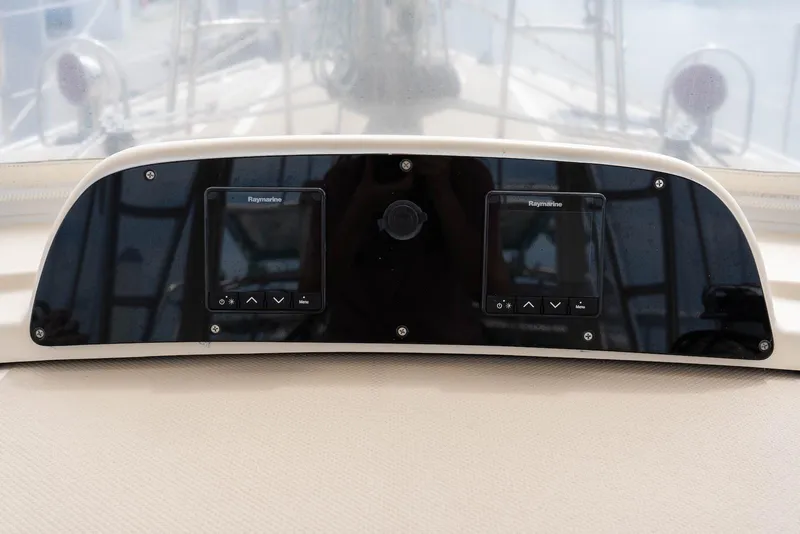 Slide: The Image of Control panel of a 2004 Island Packet 485 sailboat with Raymarine displays. - 10