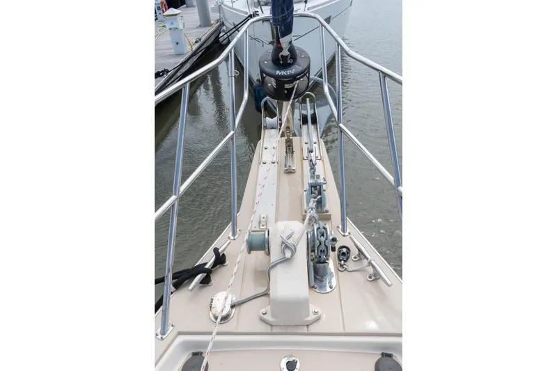 Slide: The Image of Bow view of 2004 Island Packet 485 sailboat, featuring anchor and deck equipment. - 15