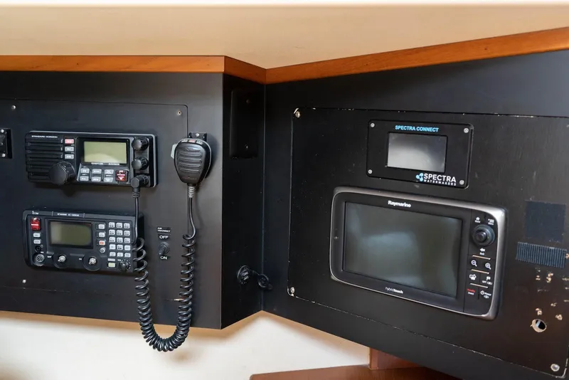 Slide: The Image of Control panel of a 2004 Island Packet 485 yacht with communication and navigation equipment. - 25