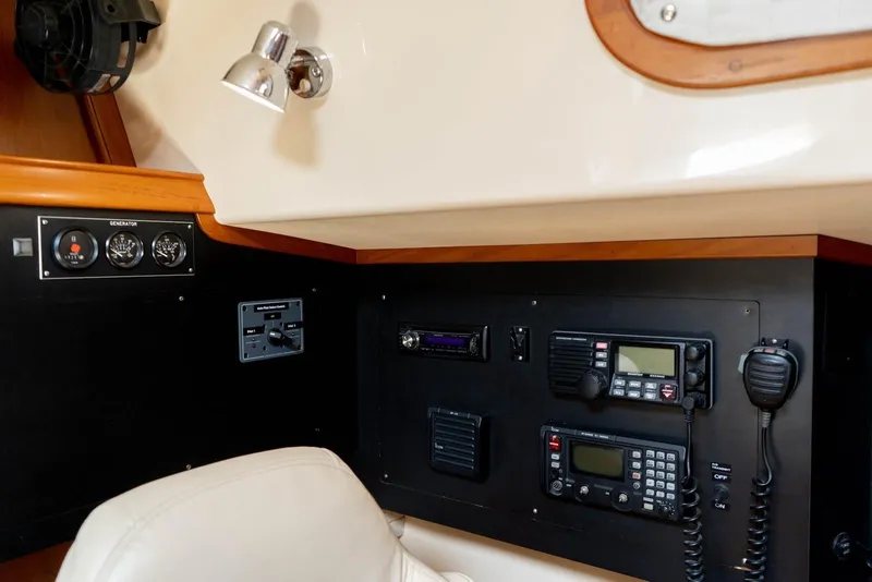 Slide: The Image of Control panel of a 2004 Island Packet 485 yacht with communication equipment. - 26
