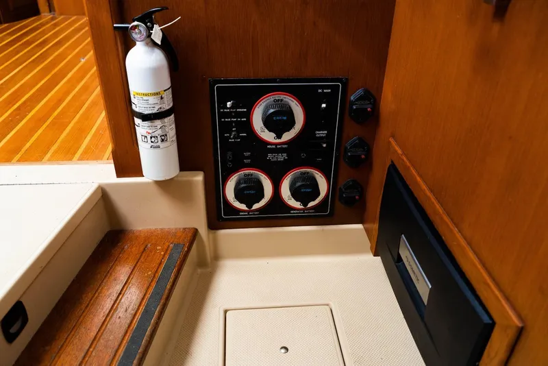 Slide: The Image of Control panel and fire extinguisher on 2004 Island Packet 485 yacht interior. - 27