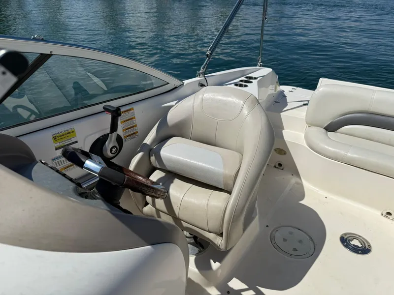 Slide: The Image of 2006 Hurricane SD 237 boat interior with steering wheel and seating. - 14