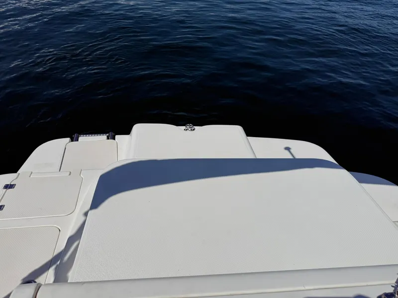 Slide: The Image of Rear deck of a 2006 Hurricane SD 237 boat on calm water. - 16
