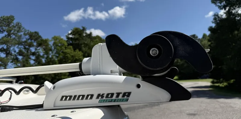 Slide: The Image of Minn Kota Riptide motor on 2006 Hurricane SD 237 boat under clear blue sky. - 4