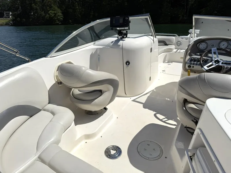 Slide: The Image of Interior of a 2006 Hurricane SD 237 boat with seating and steering wheel. - 8