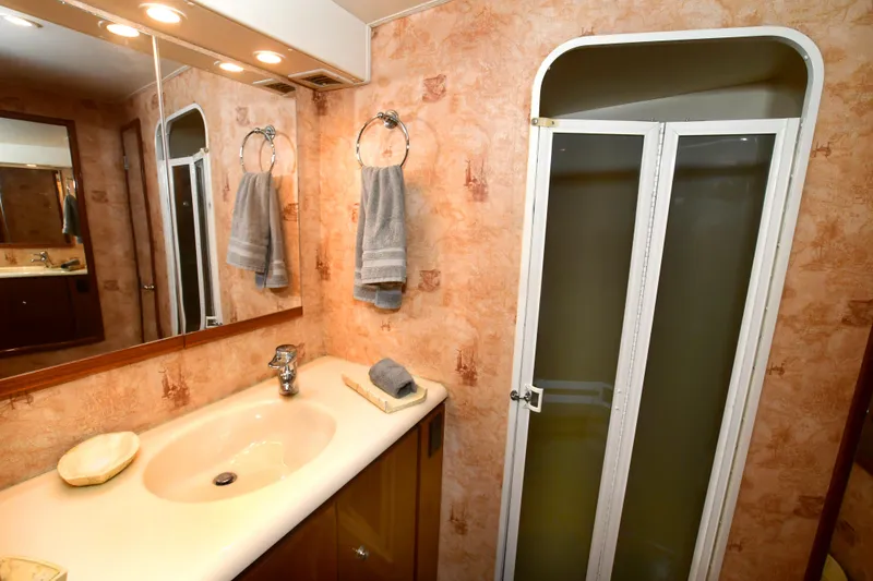 Slide: The Image of Bathroom interior of 2000 Viking Boats 65 C with sink and shower. - 11