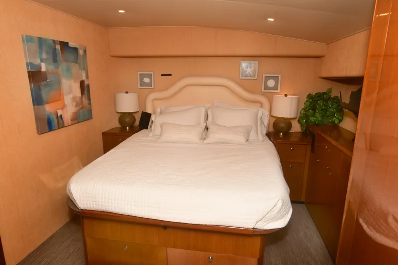 Slide: The Image of Luxurious bedroom interior of 2000 Viking Boats 65 C yacht with modern decor. - 12