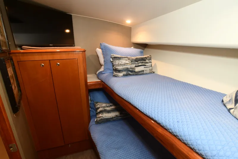 Slide: The Image of Cozy cabin with bunk beds in 2000 Viking Boats 65 C yacht. - 15