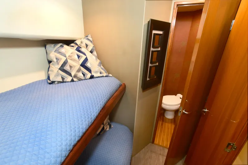 Slide: The Image of Interior of 2000 Viking Boats 65 C with bunk beds and bathroom. - 17