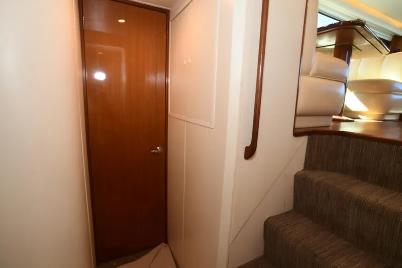 Slide: The Image of Interior of 2000 Viking Boats 65 C, featuring wooden door and carpeted stairs. - 22