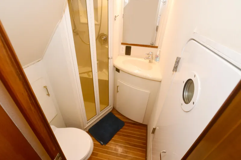 Slide: The Image of Bathroom interior of 2000 Viking Boats 65 C with shower and sink. - 24
