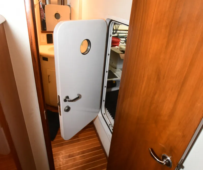 Slide: The Image of Interior of 2000 Viking Boats 65 C, featuring a wooden door and nautical design elements. - 27