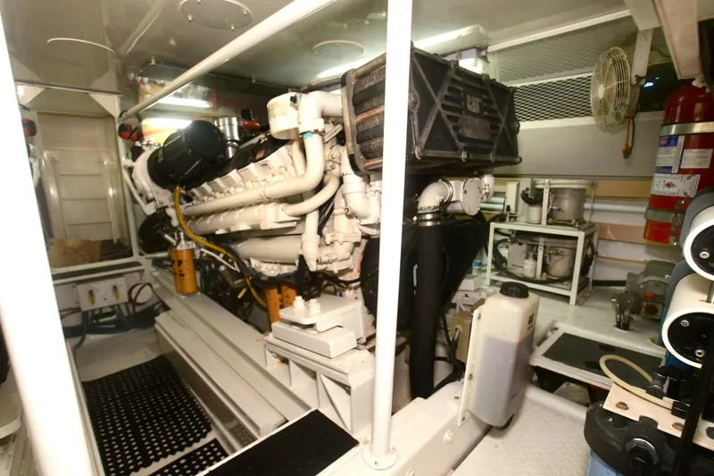 Slide: The Image of Engine room of 2000 Viking Boats 65 C, featuring a powerful marine engine. - 28