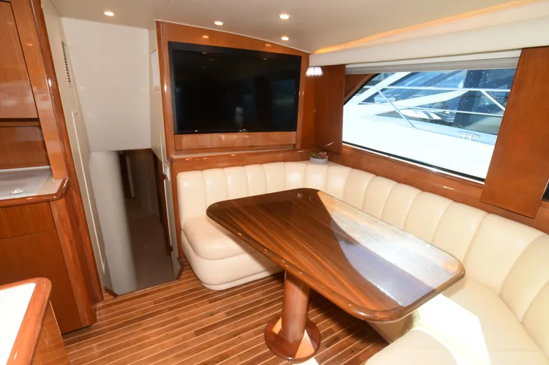 Slide: The Image of Luxurious interior of 2000 Viking Boats 65 C with wood accents and plush seating. - 33