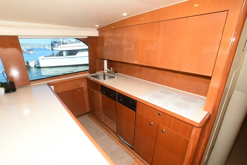Slide: The Image of Luxurious kitchen interior of 2000 Viking Boats 65 C yacht with wooden cabinetry and ocean view. - 34