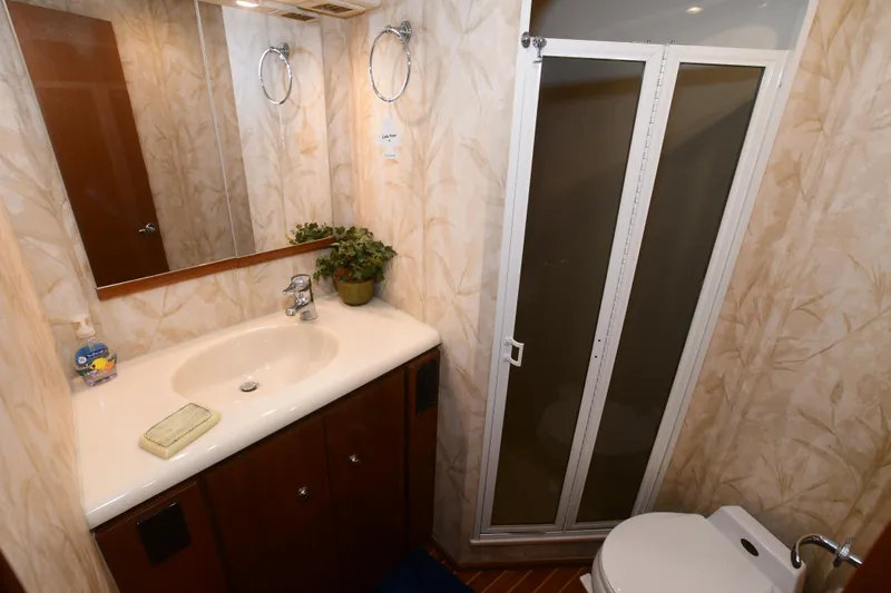 Slide: The Image of Engine room of 2000 Viking Boats 65 C, featuring dual engines and control panel. - 4