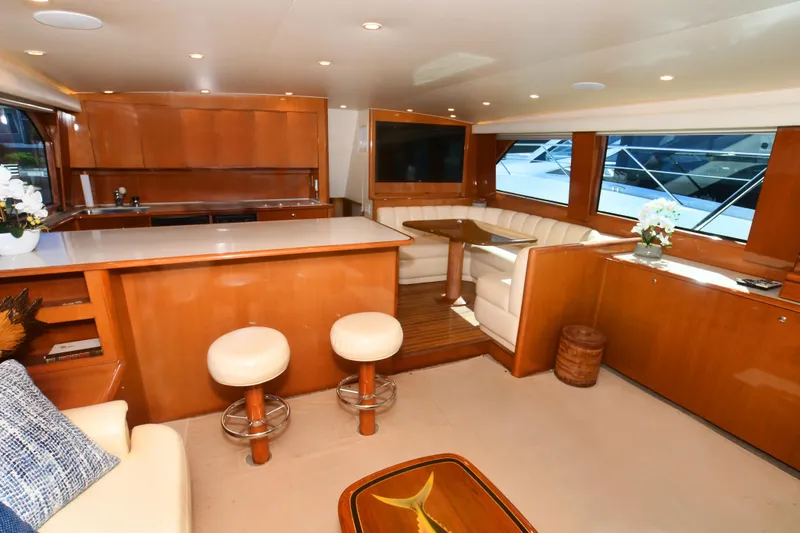 Slide: The Image of Luxurious interior of 2000 Viking Boats 65 C yacht with elegant wood finishes and seating. - 40