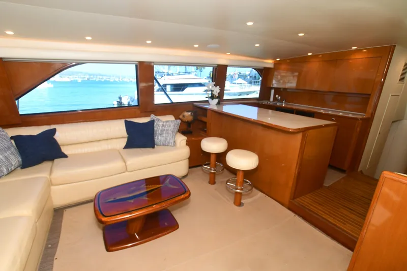 Slide: The Image of Luxurious interior of 2000 Viking Boats 65 C yacht with elegant seating and bar area. - 41