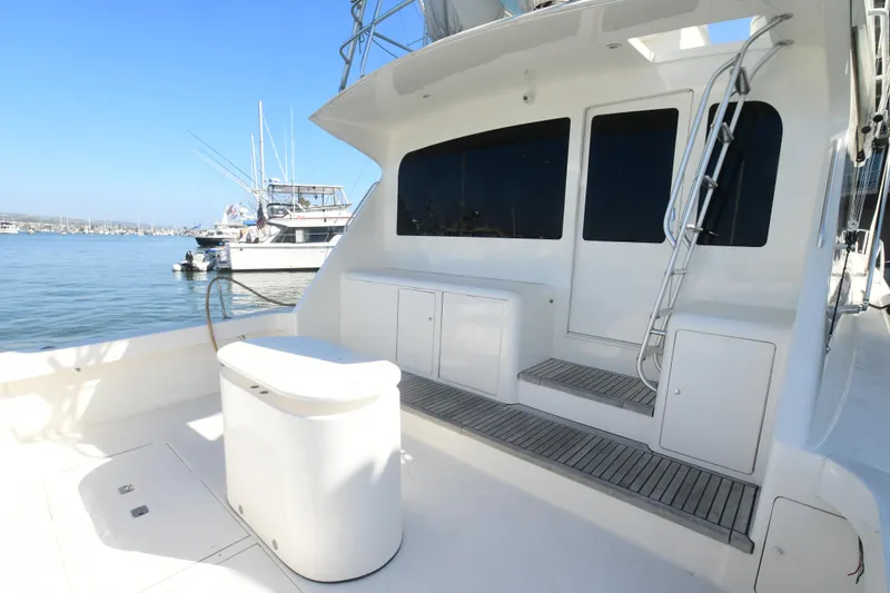 Slide: The Image of Viking Boats 65 C 2000 model, spacious deck with seating, docked in marina. - 43