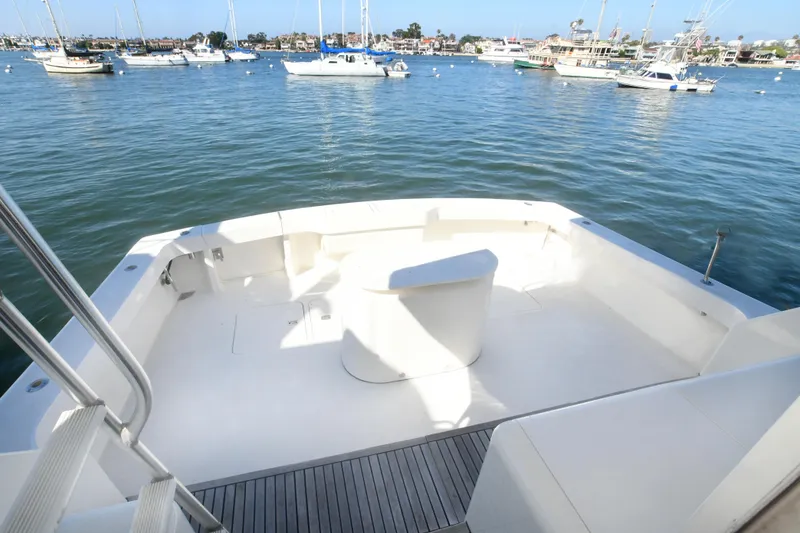 Slide: The Image of Open deck of 2000 Viking Boats 65 C, overlooking a marina with moored boats. - 44