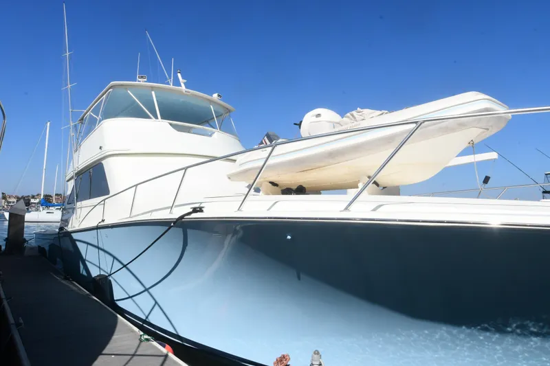 Slide: The Image of Viking Boats 65 C yacht, 2000 model, docked under clear blue sky. - 45