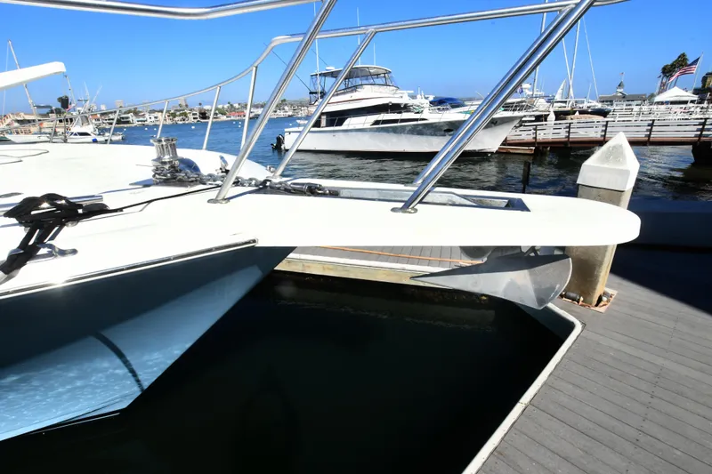 Slide: The Image of Viking Boats 65 C, 2000 model, docked at a marina with clear blue skies. - 46