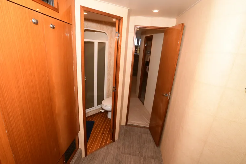 Slide: The Image of Interior of 2000 Viking Boats 65 C, featuring a bathroom with wooden accents. - 5