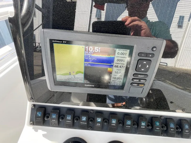Slide: The Image of Garmin GPS display on 2017 Sea Hunt Ultra 234 boat dashboard. - 25