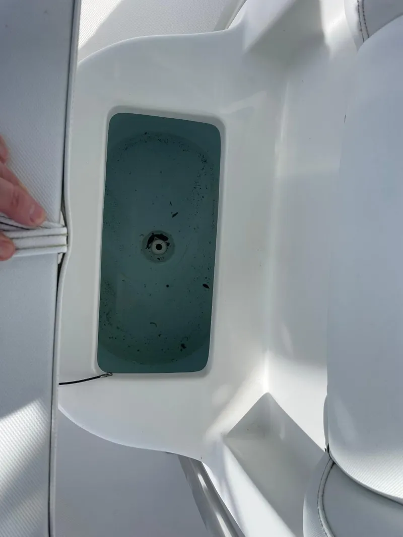 Slide: The Image of 2017 Sea Hunt Ultra 234 boat storage compartment with open lid. - 29