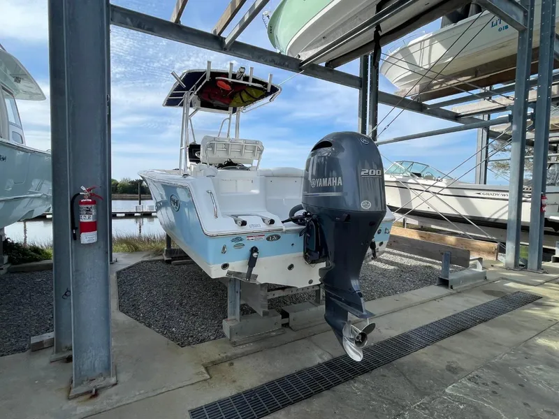 Slide: The Image of 2017 Sea Hunt Ultra 234 boat with Yamaha 200 engine in dry dock storage. - 6