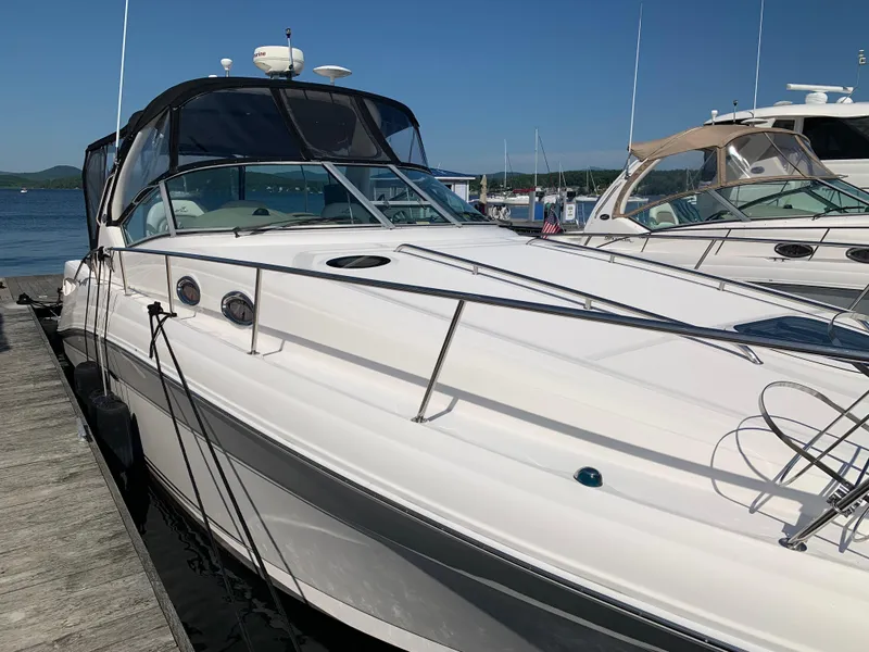 Slide: The Image of 2006 Sea Ray 340 Sundancer yacht docked at marina under clear blue sky. - 12